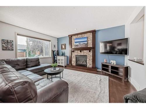 56 Reunion Close Nw, Airdrie, AB - Indoor Photo Showing Living Room With Fireplace