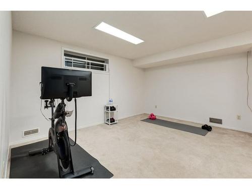 73 Stratford Place Sw, Calgary, AB - Indoor Photo Showing Gym Room