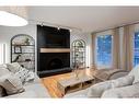 73 Stratford Place Sw, Calgary, AB  - Indoor Photo Showing Living Room With Fireplace 