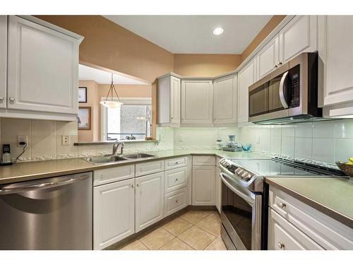 205-200 La Caille Place Sw, Calgary, AB - Indoor Photo Showing Kitchen With Stainless Steel Kitchen With Double Sink