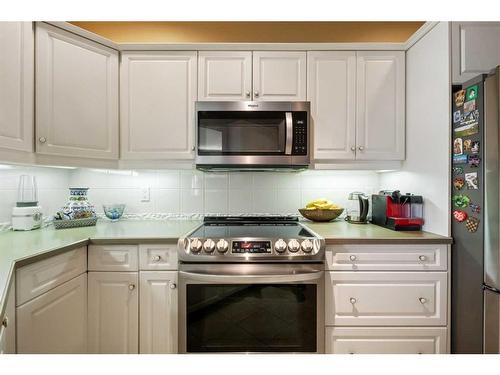 205-200 La Caille Place Sw, Calgary, AB - Indoor Photo Showing Kitchen With Stainless Steel Kitchen With Upgraded Kitchen