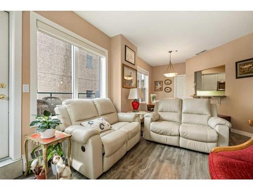 205-200 La Caille Place Sw, Calgary, AB - Indoor Photo Showing Living Room