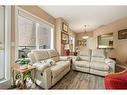 205-200 La Caille Place Sw, Calgary, AB  - Indoor Photo Showing Living Room 