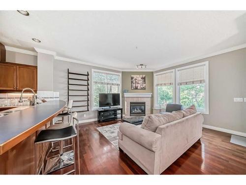 214-59 22 Avenue Sw, Calgary, AB - Indoor Photo Showing Living Room With Fireplace