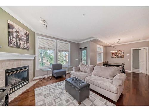 214-59 22 Avenue Sw, Calgary, AB - Indoor Photo Showing Living Room With Fireplace