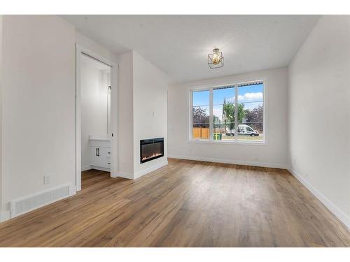 28 B Green Meadow Crescent, Strathmore, AB - Indoor Photo Showing Other Room With Fireplace