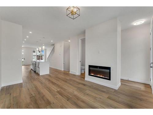 28 B Green Meadow Crescent, Strathmore, AB - Indoor Photo Showing Living Room With Fireplace