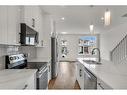 28 B Green Meadow Crescent, Strathmore, AB  - Indoor Photo Showing Kitchen With Double Sink With Upgraded Kitchen 