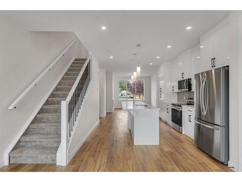 28 B Green Meadow Crescent, Strathmore, AB - Indoor Photo Showing Kitchen With Upgraded Kitchen