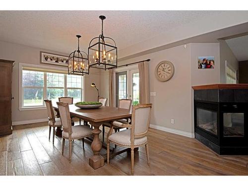 29 Ranch Road, Okotoks, AB - Indoor Photo Showing Dining Room With Fireplace