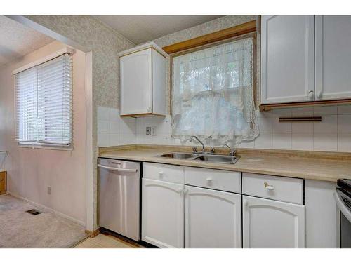 3320 Temple Way Ne, Calgary, AB - Indoor Photo Showing Kitchen With Double Sink