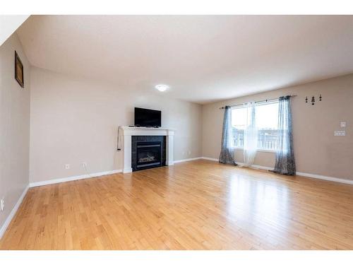 7 Saddlecrest Terrace Ne, Calgary, AB - Indoor Photo Showing Living Room With Fireplace