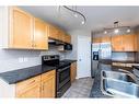 7 Saddlecrest Terrace Ne, Calgary, AB  - Indoor Photo Showing Kitchen With Stainless Steel Kitchen With Double Sink 