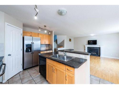 7 Saddlecrest Terrace Ne, Calgary, AB - Indoor Photo Showing Kitchen With Double Sink