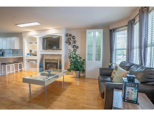 30 Country Village Landing Ne, Calgary, AB - Indoor Photo Showing Living Room With Fireplace