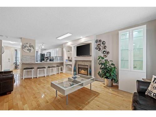 30 Country Village Landing Ne, Calgary, AB - Indoor Photo Showing Living Room With Fireplace