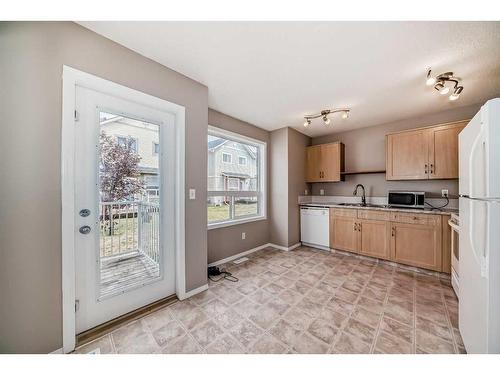 1601-111 Tarawood Lane Ne, Calgary, AB - Indoor Photo Showing Kitchen With Double Sink