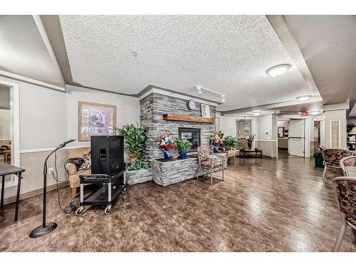 3324-3000 Millrise Point Sw, Calgary, AB - Indoor With Fireplace