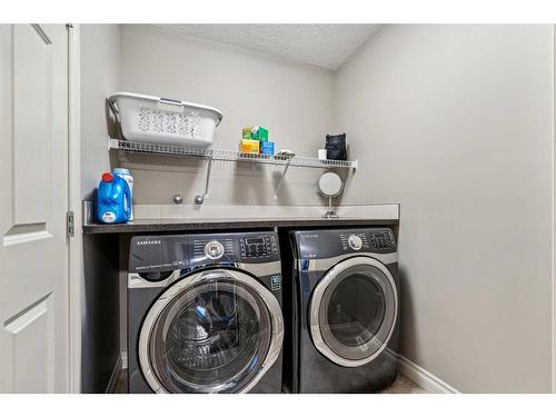 63 Jumping Pound Terrace, Cochrane, AB - Indoor Photo Showing Laundry Room