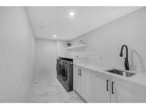 1028 Lake Ontario Drive Se, Calgary, AB - Indoor Photo Showing Laundry Room