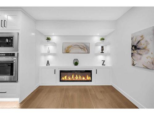 1028 Lake Ontario Drive Se, Calgary, AB - Indoor Photo Showing Living Room With Fireplace