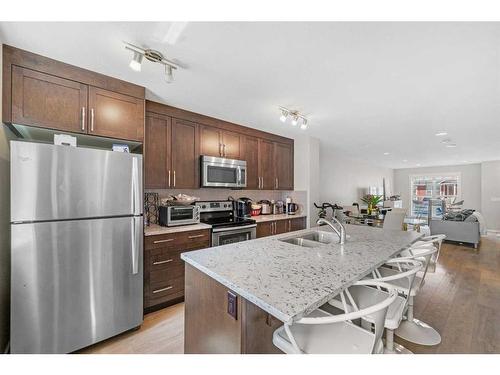 618 Cranford Mews Se, Calgary, AB - Indoor Photo Showing Kitchen With Double Sink With Upgraded Kitchen