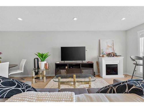 618 Cranford Mews Se, Calgary, AB - Indoor Photo Showing Living Room With Fireplace