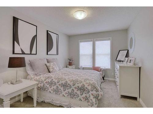 116 Sunset Manor, Cochrane, AB - Indoor Photo Showing Bedroom