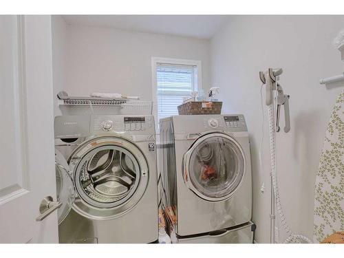 116 Sunset Manor, Cochrane, AB - Indoor Photo Showing Laundry Room