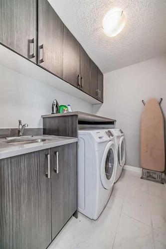 1-1714 Kensington Road Nw, Calgary, AB - Indoor Photo Showing Laundry Room