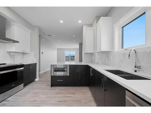 599 Mahogany Road Se, Calgary, AB - Indoor Photo Showing Kitchen With Double Sink With Upgraded Kitchen