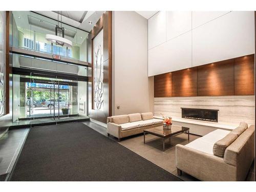 555-222 Riverfront Avenue Sw, Calgary, AB - Indoor With Fireplace