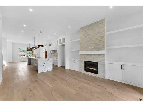 4626 20 Avenue Nw, Calgary, AB - Indoor Photo Showing Living Room With Fireplace