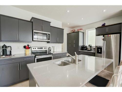 608 Monterey Drive Se, High River, AB - Indoor Photo Showing Kitchen With Double Sink With Upgraded Kitchen