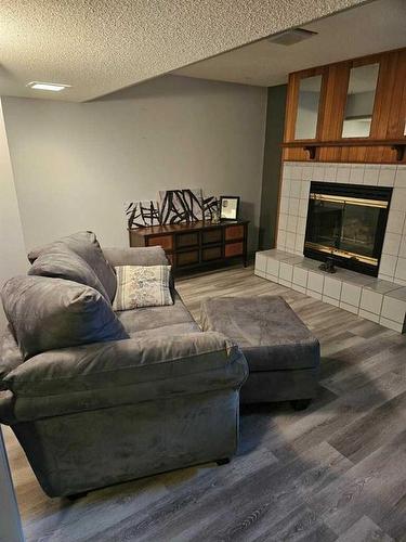 1613 13 Avenue North, Lethbridge, AB - Indoor Photo Showing Living Room With Fireplace