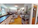 121 Sunbank Way Se, Calgary, AB  - Indoor Photo Showing Kitchen With Double Sink 