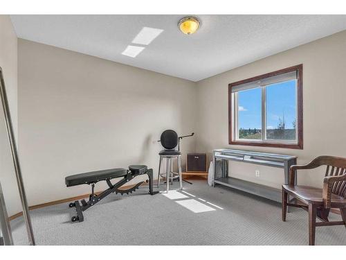 566 Saddlecreek Way Ne, Calgary, AB - Indoor Photo Showing Gym Room