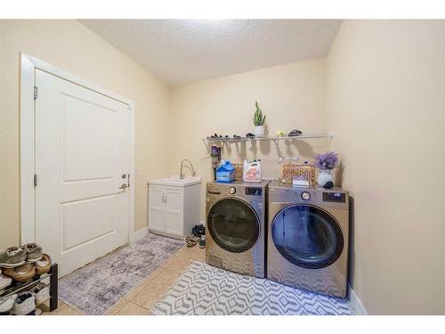 168 Kinniburgh Boulevard, Chestermere, AB - Indoor Photo Showing Laundry Room