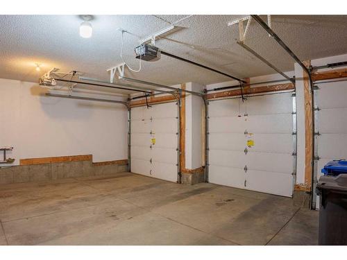 168 Kinniburgh Boulevard, Chestermere, AB - Indoor Photo Showing Garage