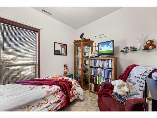 4902 51 Avenue, Olds, AB - Indoor Photo Showing Bedroom