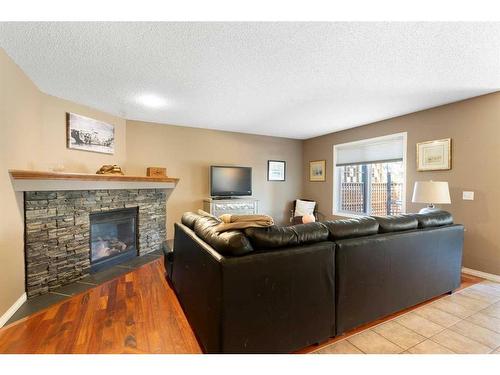 259 Chapalina Terrace Se, Calgary, AB - Indoor Photo Showing Living Room With Fireplace