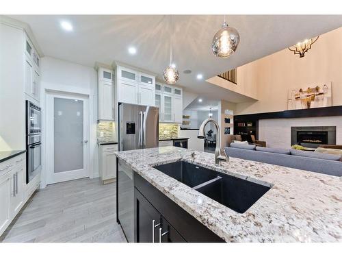 84 Aspen Dale Way Sw, Calgary, AB - Indoor Photo Showing Kitchen With Double Sink With Upgraded Kitchen