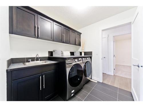 84 Aspen Dale Way Sw, Calgary, AB - Indoor Photo Showing Laundry Room