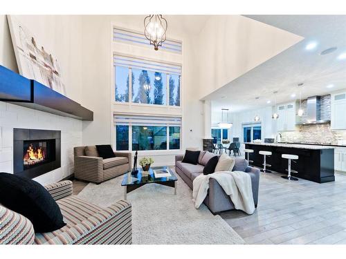 84 Aspen Dale Way Sw, Calgary, AB - Indoor Photo Showing Living Room With Fireplace