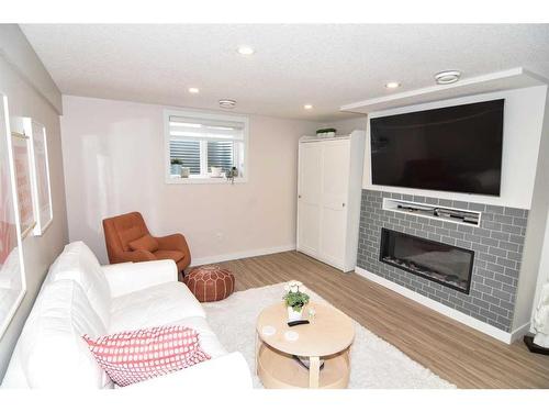 123 Huntchester Crescent Ne, Calgary, AB - Indoor Photo Showing Living Room With Fireplace