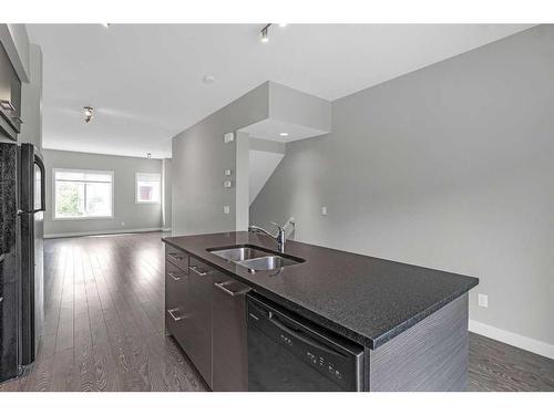 8 Stonehouse Crescent Nw, High River, AB - Indoor Photo Showing Kitchen With Double Sink