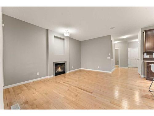 28 Cougar Ridge Manor Sw, Calgary, AB - Indoor Photo Showing Living Room With Fireplace