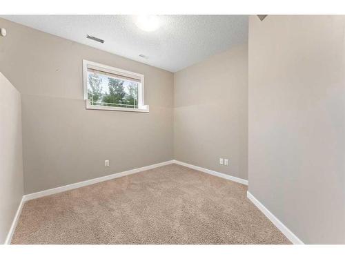 28 Cougar Ridge Manor Sw, Calgary, AB - Indoor Photo Showing Other Room