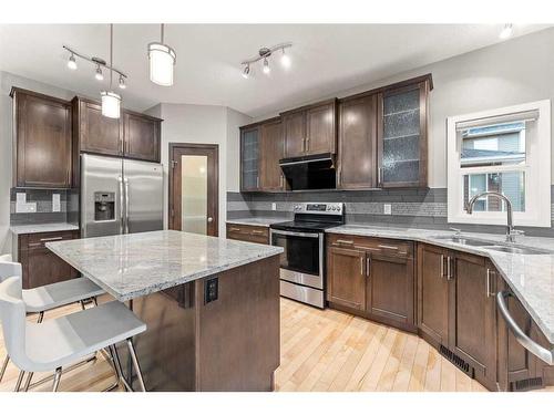 28 Cougar Ridge Manor Sw, Calgary, AB - Indoor Photo Showing Kitchen With Double Sink With Upgraded Kitchen