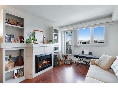 16-2104 17 Street Sw, Calgary, AB - Indoor Photo Showing Living Room With Fireplace